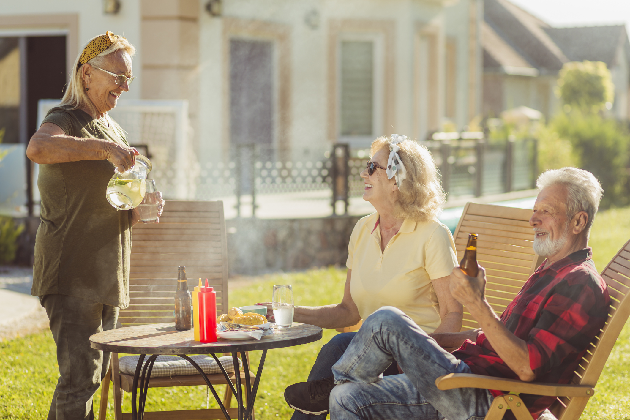 Elderly people having an outdoor lunch